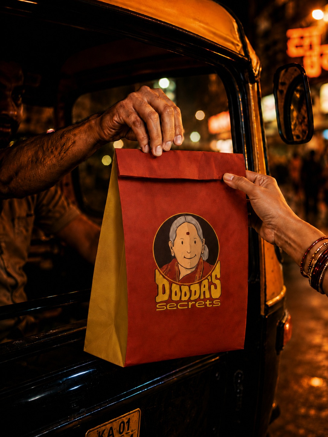 Dodda's Secrets takeaway bag being handed over